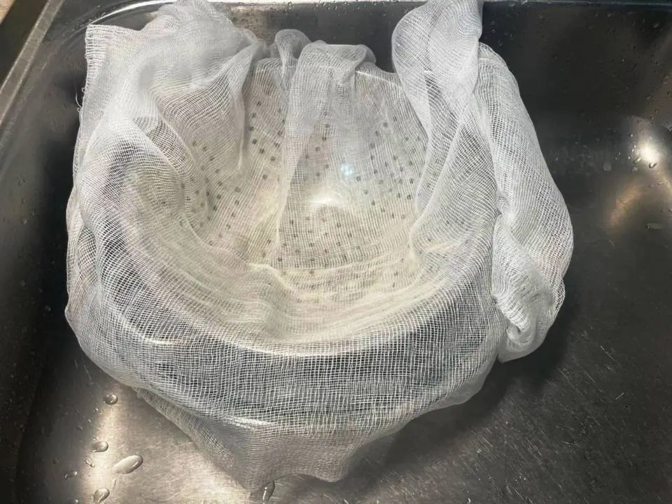 CHEESECLOTH IN STRAINER