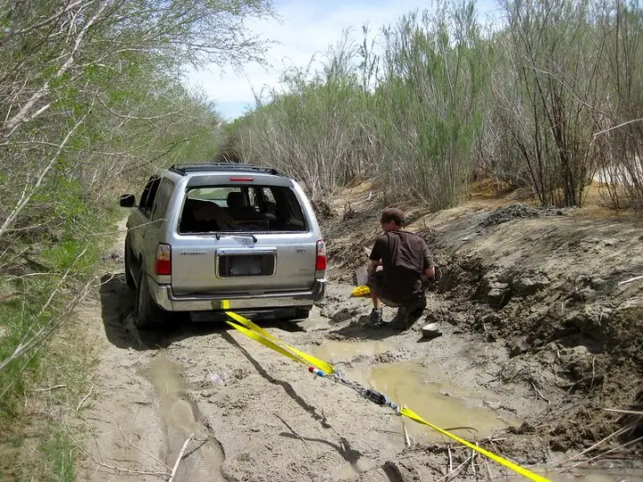 Come-Along Winch Pulling Car Out Of Mud