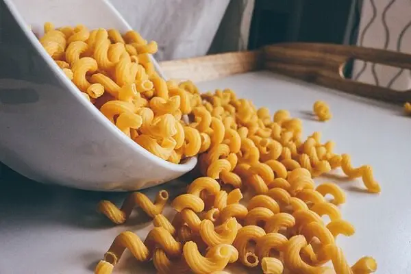 Dried Pasta Spilling Out Of Bowl