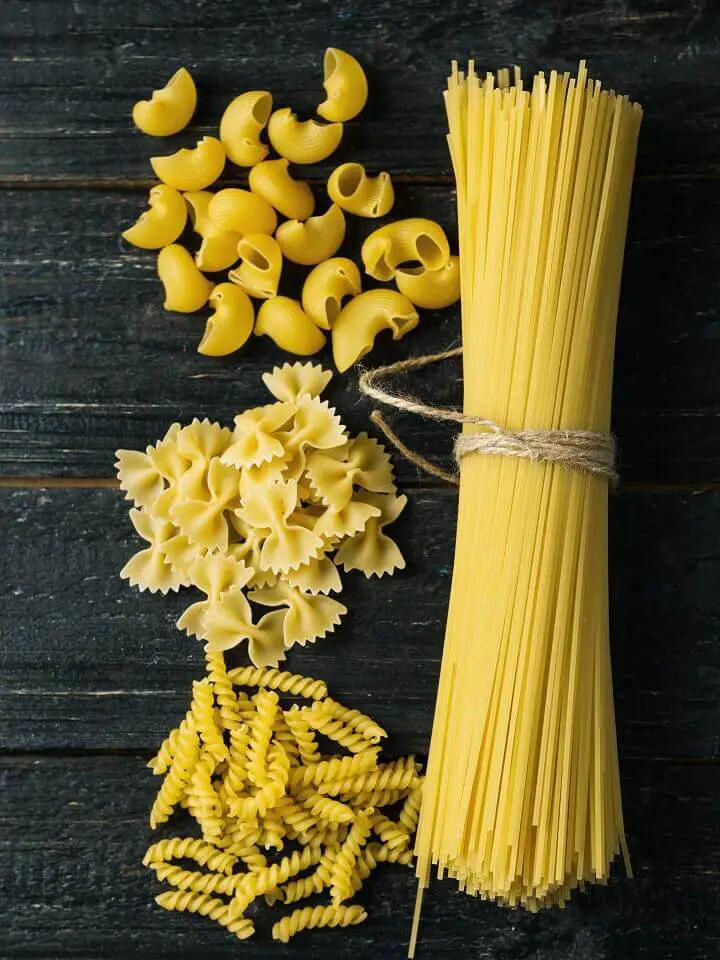 Dry Pasta on a Dark Table