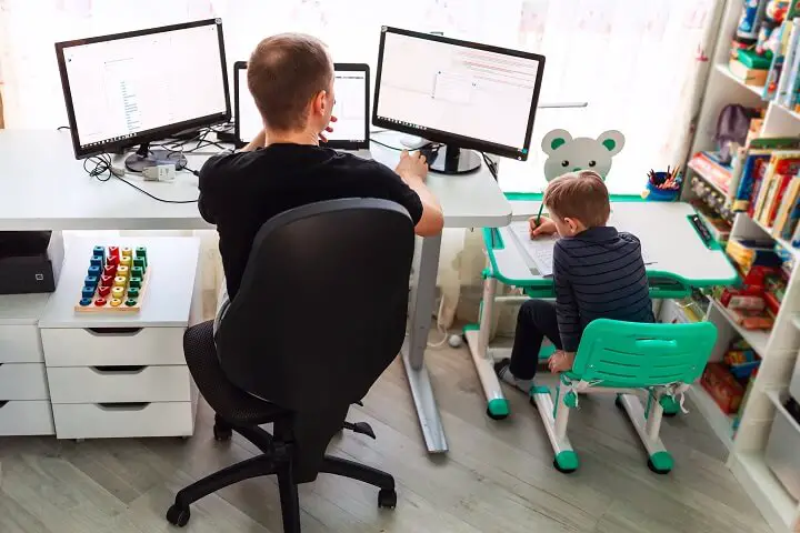 Father Working From Home With Son