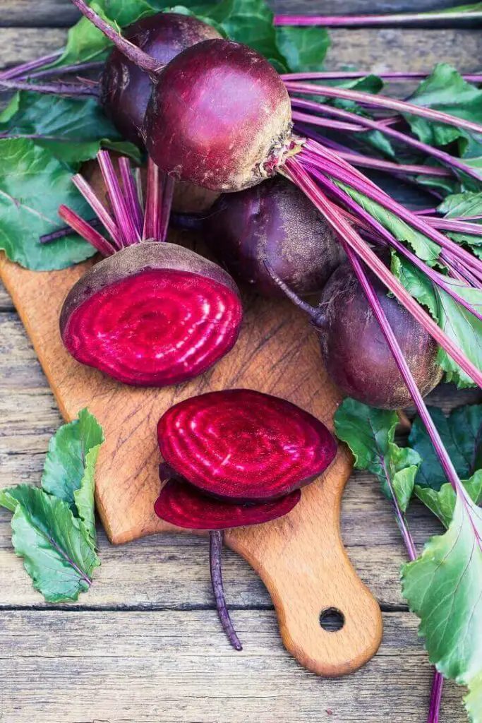 Fresh Sliced Beets On Wood Table