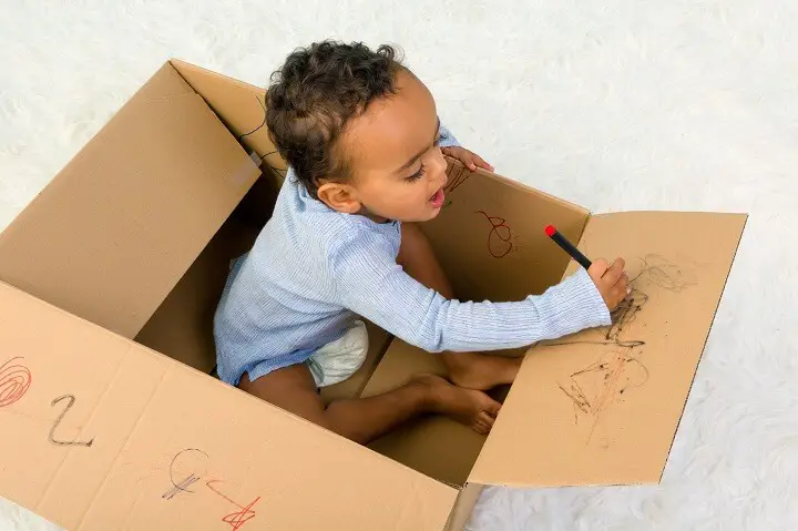 Kid Drawing On Box