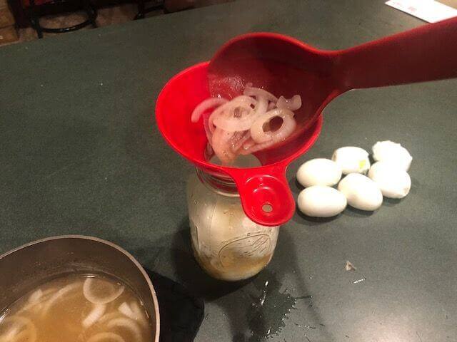 Ladle of Pickled Egg Brine Into Jar