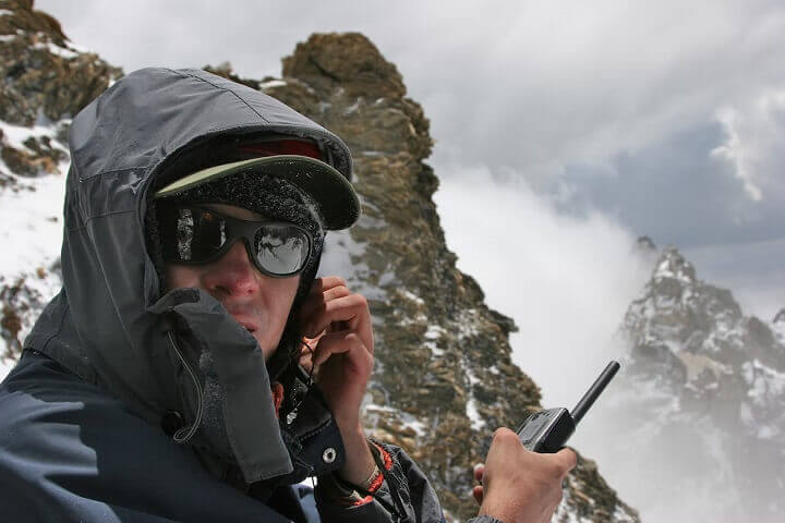 Man Holding Satellite Phone