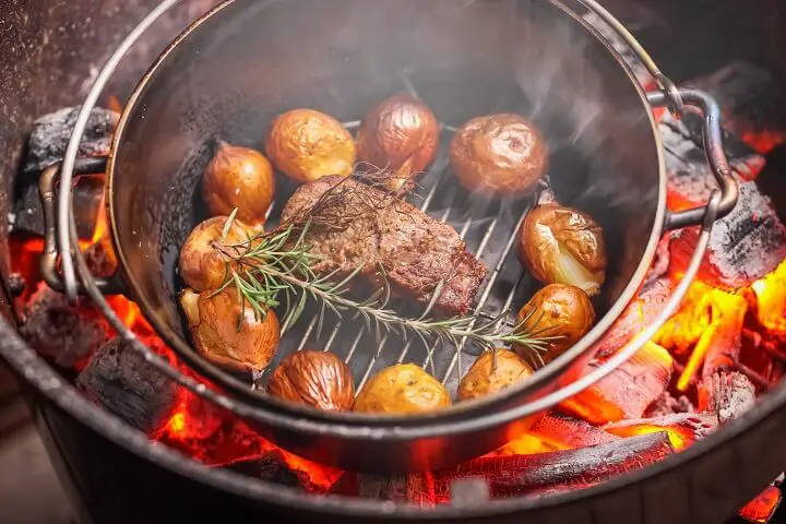 Meat And Onions Cooking In Dutch Oven