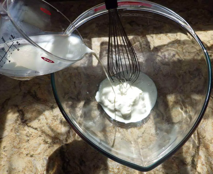 Milk Pouring Into Yogurt Bowl