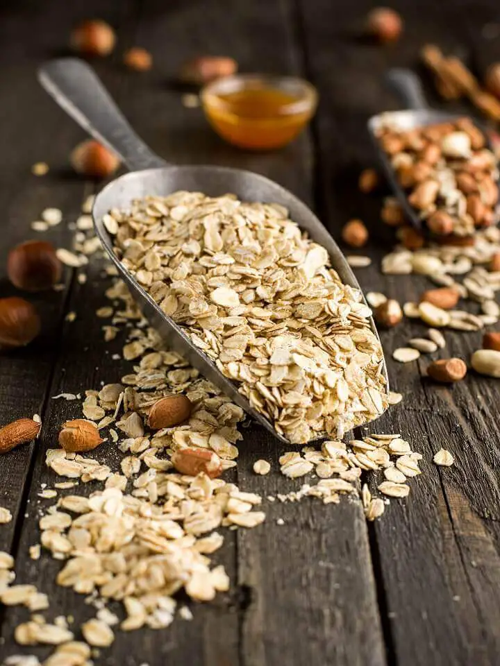 Oats in Scoop on Wooden Table
