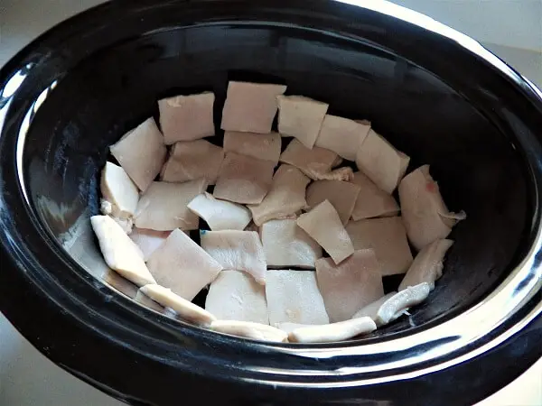 Pork Pieces And Beginning Layer In The Crockpot