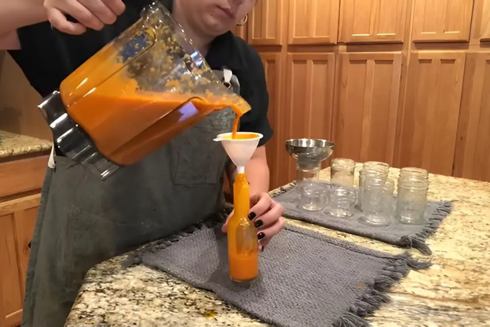Pouring Into Bottle