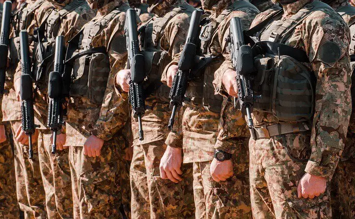 Soldiers Holding Firearms Under Martial Law