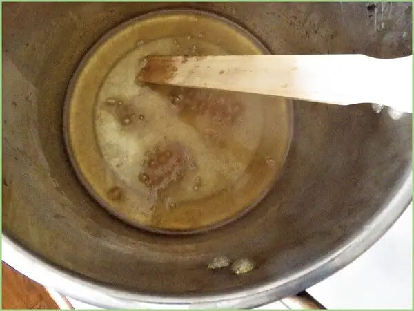 Stirring Lye and Lard Over Low Heat