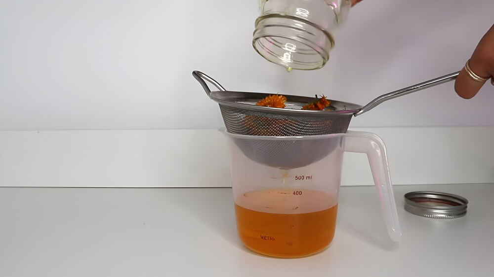 Straining Calendula Infusion
