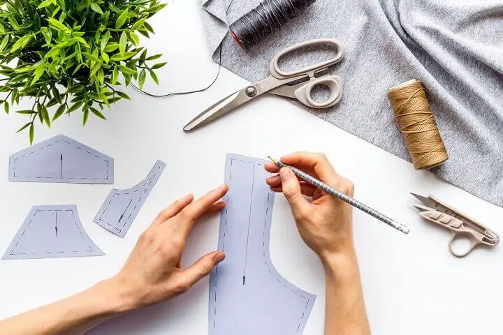 Tailor Designing Clothes