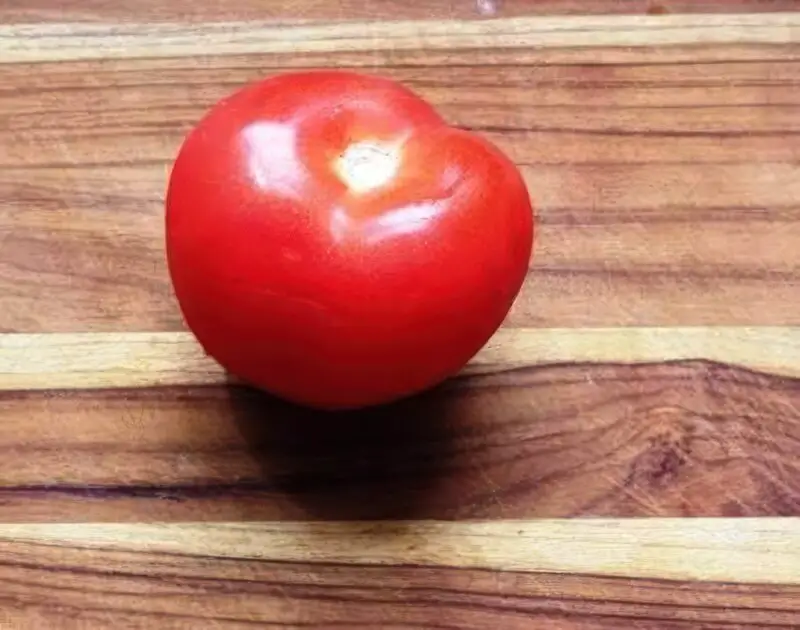 Tomato on Cutting Board