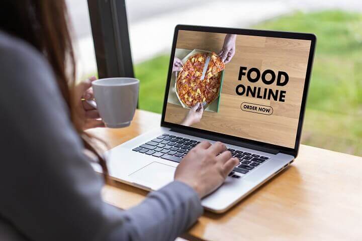 Woman Ordering Pizza Online