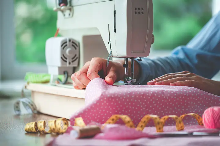 Woman Sewing Dress With Machine